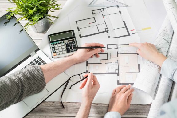 Designing a home looking at floor plans